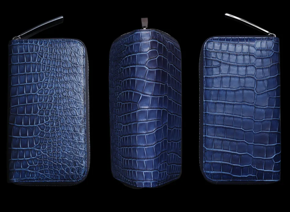 【池田工芸 藍染めクロコダイル長財布 の商品画像③】クロコダイル財布には、鱗の取り方で色々な種類に分類できます。今回のこのモデルは「センター・ホールカット」と呼ばれる手法。クロコダイルの中心からドーンと継ぎ接ぎ無しで、素材を採取する非常に贅沢な採取法です。